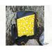 Cute crossbody travel bag with three pockets.  Bee print and Sun yellow lining.  Long strap and Goldtone hardware.